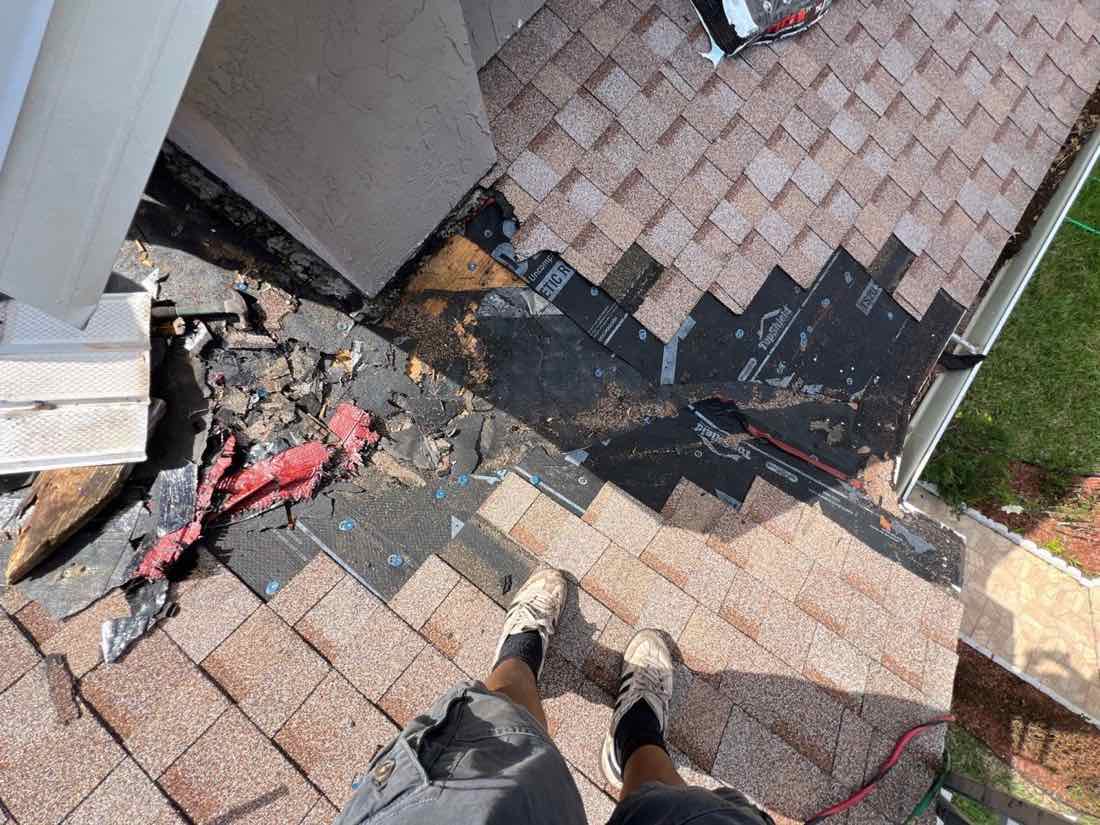 Rotted decking found under the shingles